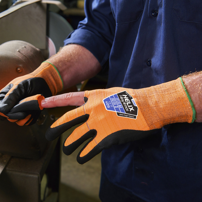 Hands wearing the Helix 1092 tear-away gloves with one finger being removed to showcase the breakaway finger technology.