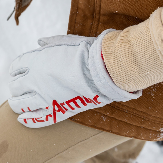 Worker wearing the Chrome SLT 4066W extreme cold weather gloves while outdoors in the snow.