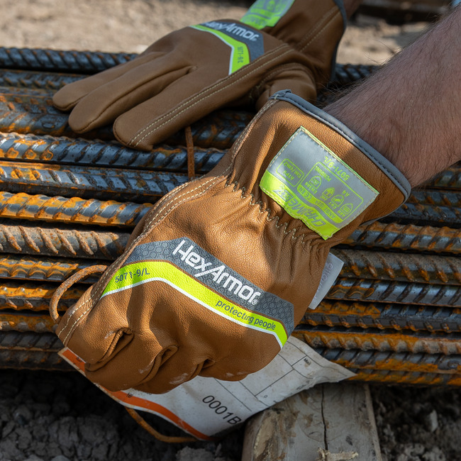 Hands wearing chrome slt 5071 water and oil resistant gloves with sustainable leather treatment.
