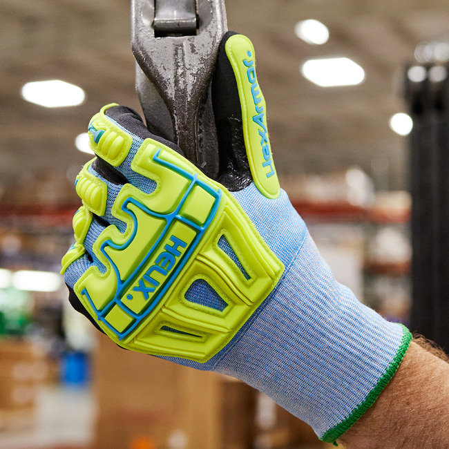Hands wearing Helix 3010 impact gloves holding a heavy tool.