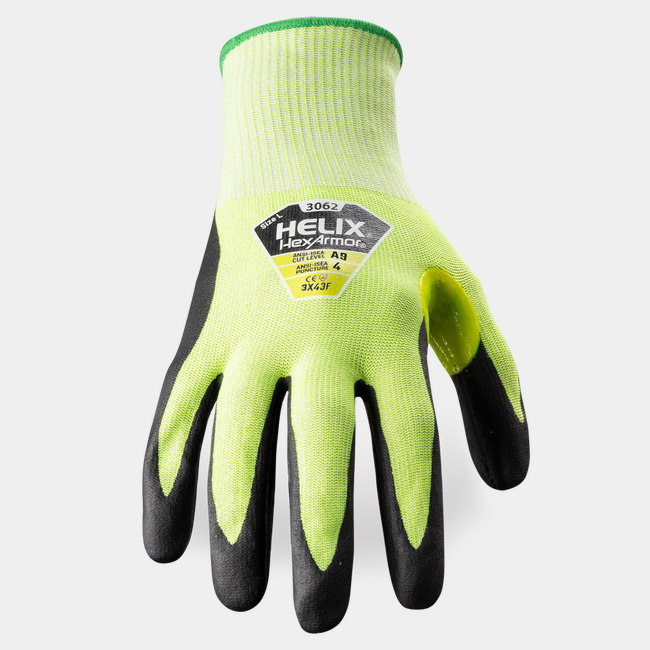Back of hand view of Helix 3062 hi-vis work gloves showcasing the label.