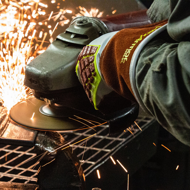 Worker wearing HeatArmor 5055 welding glove in a hot work task.
