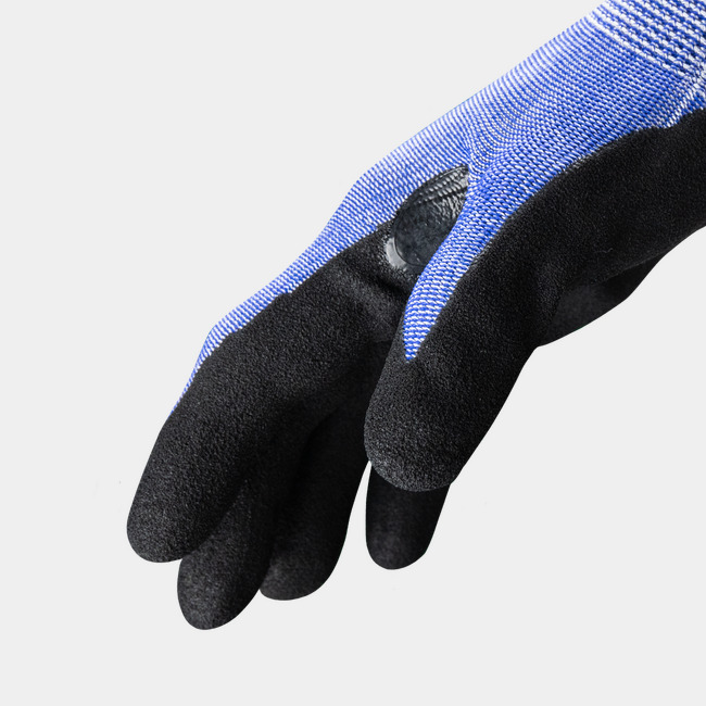 Side view of Helix 2074 puncture-resistant gloves, showcasing the seamless knit and reinforced thumb saddle.