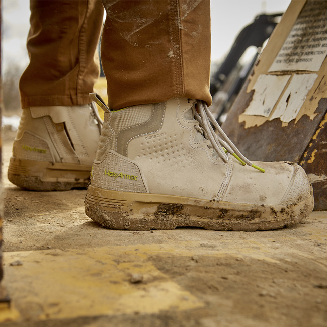Construction worker standing in Xtend women's comfortable work boots on a step. 
