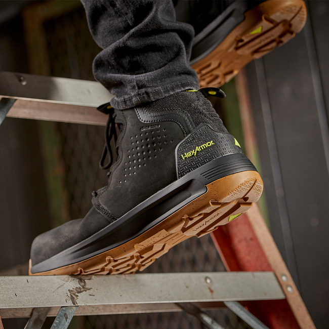 Construction worker standing in Xtend black safety boots on a step. 