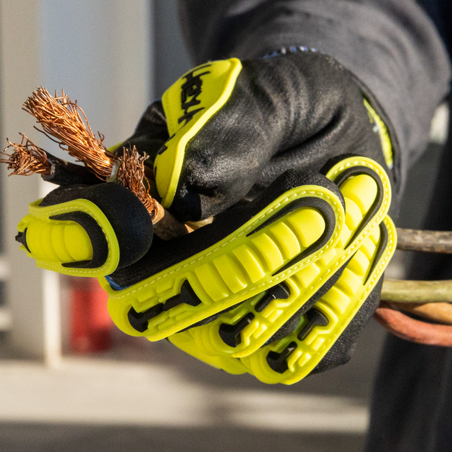 Hand wearing the 3016 Helix impact gloves holing a frayed wire cable.