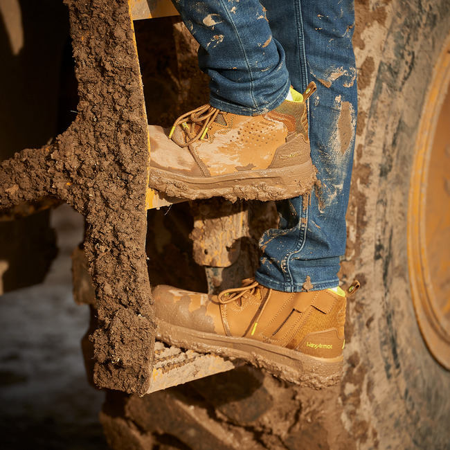 Construction worker standing in Xtend tan comfortable work boots.