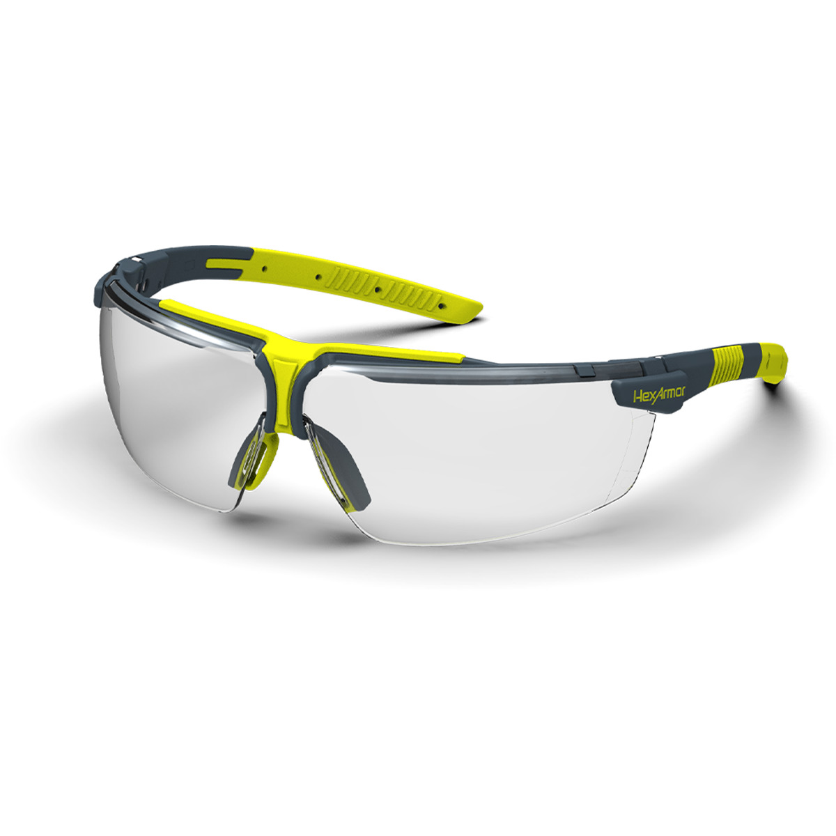 Grey and yellow VS300 anti-fog safety glasses shown as they are sitting on a table.